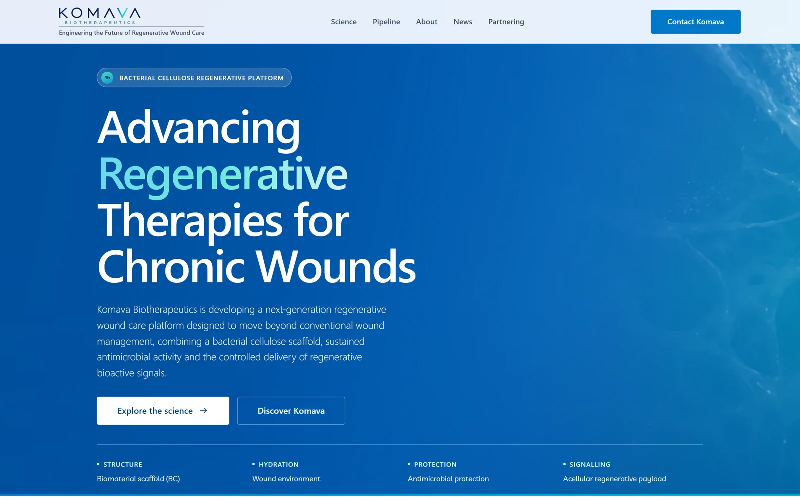 Komava Biotherapeutics homepage with a deep blue scientific hero